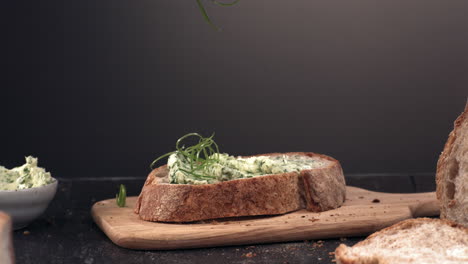 CU-SUPER-SLOW-MOTION-sprinkling-onion-over-bread-sandwich-with-green-butter.-Shot-with-high-speed-camera-at-420-FPS